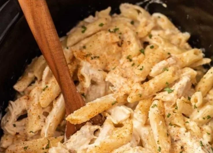 Crock Pot Cajun Chicken Pasta with creamy sauce and spices