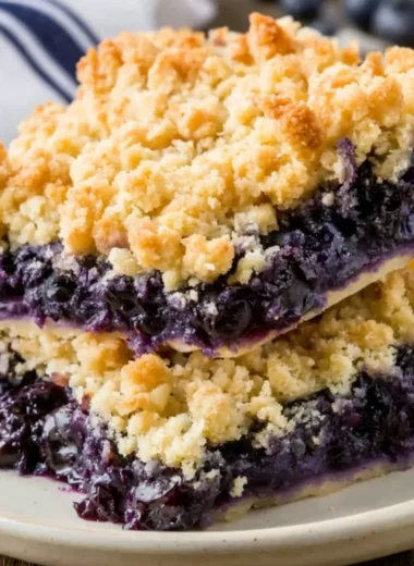 Delicious homemade blueberry crisp topped with crunchy oats and sugar