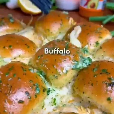 Buffalo Chicken Sliders served on a platter with fresh vegetables
