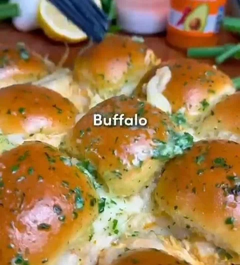 Buffalo Chicken Sliders served on a platter with fresh vegetables