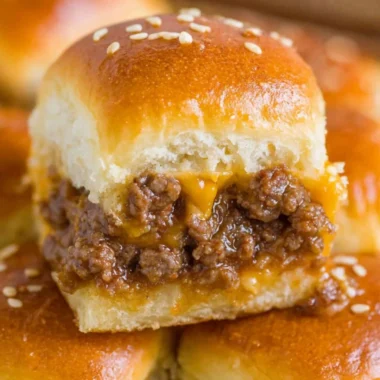Delicious cheeseburger sliders on a serving platter with toppings