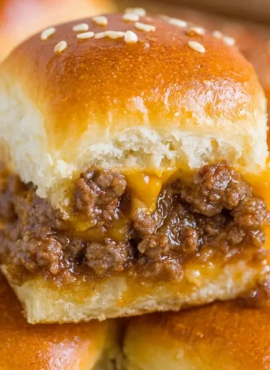 Delicious cheeseburger sliders on a serving platter with toppings