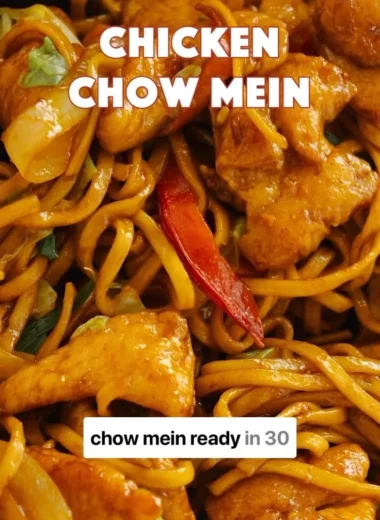 Plate of Chicken Chow Mein with vegetables and chicken stir-fried noodles