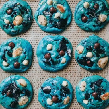 Freshly baked Cookie Monster cookies with chocolate chips and colorful sprinkles