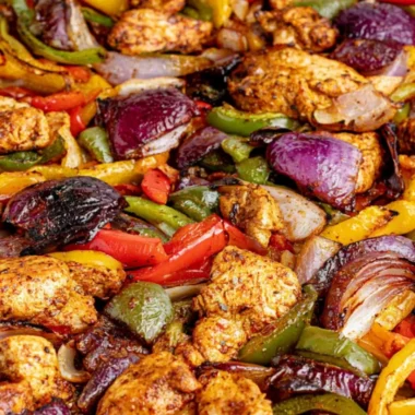 Sheet pan chicken fajitas with colorful bell peppers and spices ready to serve