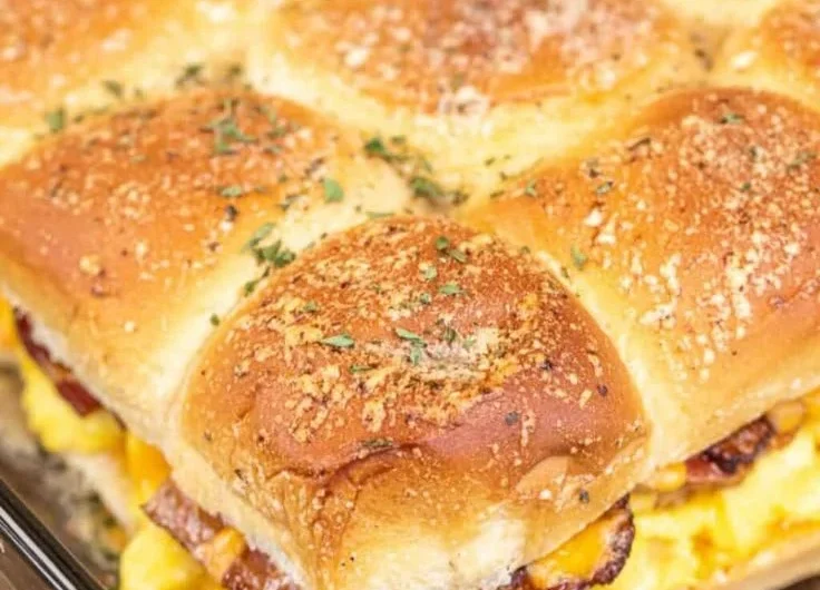 Delicious Crack Breakfast Sliders served on a platter with toppings and sauces.