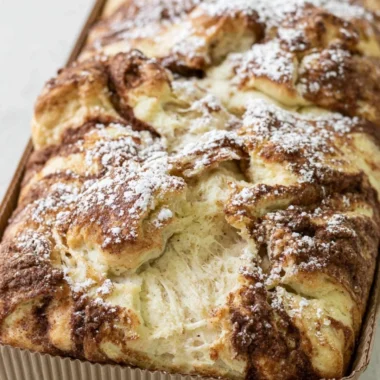 Delicious cinnamon swirl protein cake topped with a swirl of cinnamon and sugar