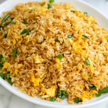 A bowl of quick and easy 10-minute fried rice with colorful vegetables.