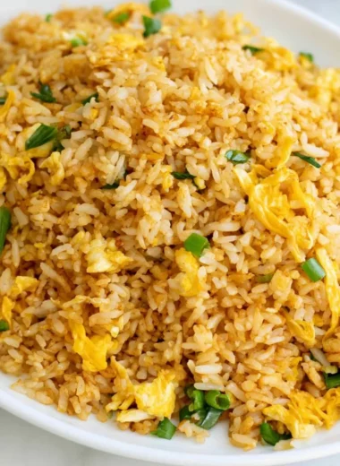A bowl of quick and easy 10-minute fried rice with colorful vegetables.