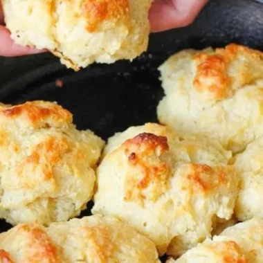 Freshly baked easy drop biscuits on a cooling rack.