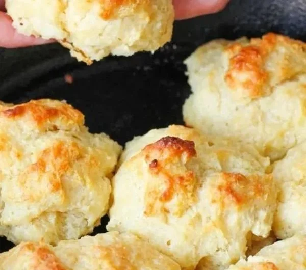 Freshly baked easy drop biscuits on a cooling rack.