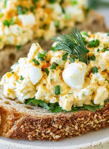 Delicious egg salad with dill served in a bowl, perfect for lunch or snacks