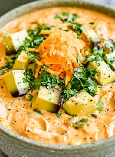 Bowl of healthy high protein white chicken chili with fresh ingredients