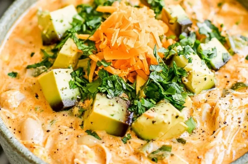 Bowl of healthy high protein white chicken chili with fresh ingredients