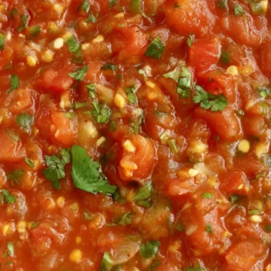 A bowl of homemade smoked salsa with fresh ingredients and smoky flavor.