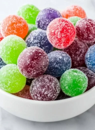 Colorful Kool-Aid Grapes arranged on a plate, ready to be enjoyed.