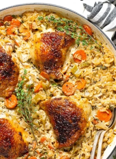 One Pan Chicken Rice Casserole topped with fresh herbs and spices