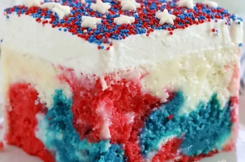 Patriotic poke cake with red, white, and blue layers for 4th of July celebration