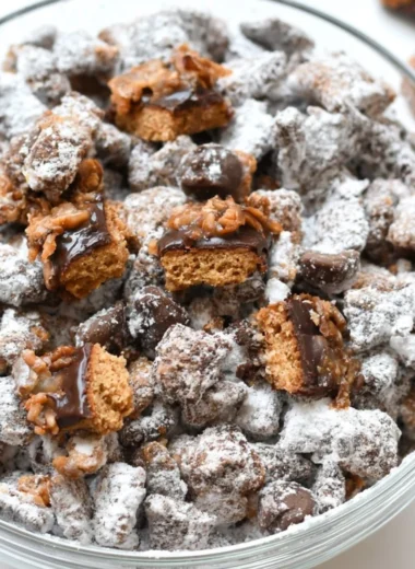 A bowl of Samoas Puppy Chow, a delicious and sweet snack mix.