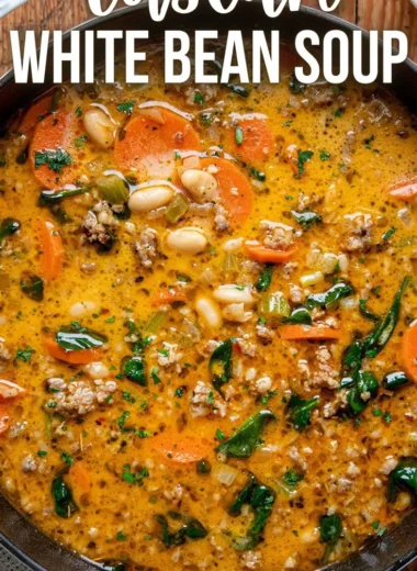 Bowl of Tuscan white bean soup garnished with herbs