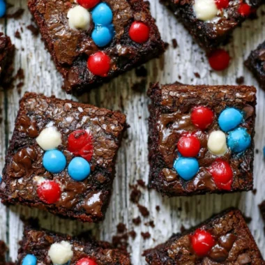 Delicious ultimate easy brownies on a plate with chocolate drizzle