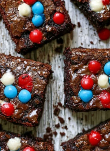 Delicious ultimate easy brownies on a plate with chocolate drizzle