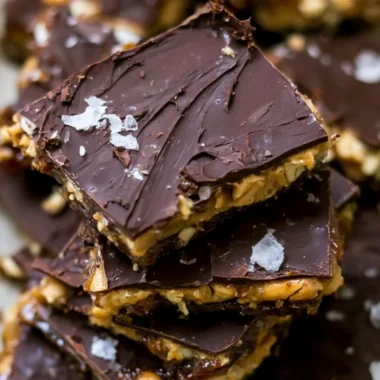 Delicious homemade Chocolate Date Bark topped with nuts and coconut flakes.