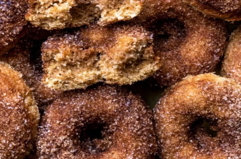 Delicious baked apple cider donuts with a sprinkle of cinnamon sugar