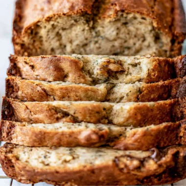 Delicious slice of easy banana bread on a wooden table