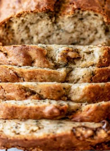 Delicious slice of easy banana bread on a wooden table