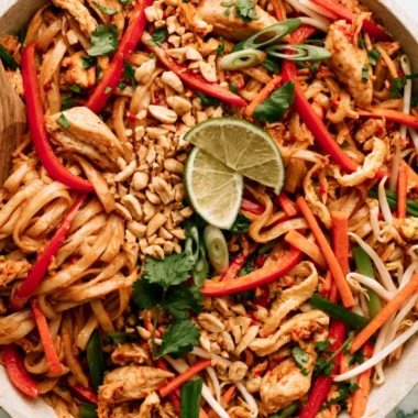 Delicious Cozy Chicken Pad Thai with vibrant vegetables and peanuts