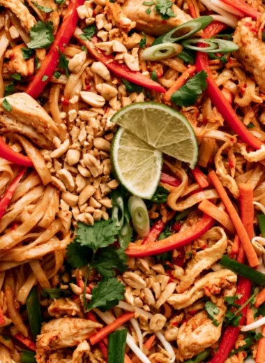 Delicious Cozy Chicken Pad Thai with vibrant vegetables and peanuts