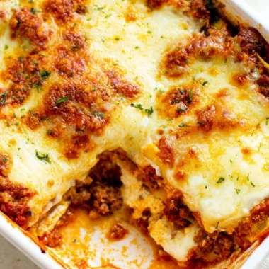 A warm and cheesy lasagna dish ready to serve, showcasing layers of pasta and sauce.