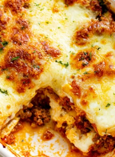 A warm and cheesy lasagna dish ready to serve, showcasing layers of pasta and sauce.