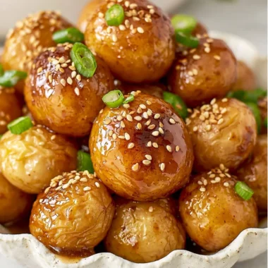Cozy Korean braised potatoes served in a bowl with seasonings