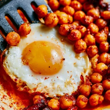Cozy chickpea fried eggs served on a plate for a warm dinner.