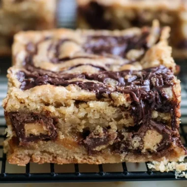 Delicious Moose Tracks Cookie Bars with chocolate and peanut butter toppings