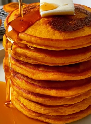 Delicious cozy pumpkin cottage cheese pancakes stacked on a plate