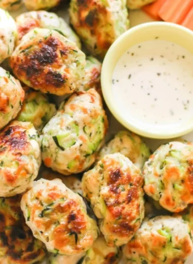 Plate of kid-friendly veggie chicken nuggets with vegetables side