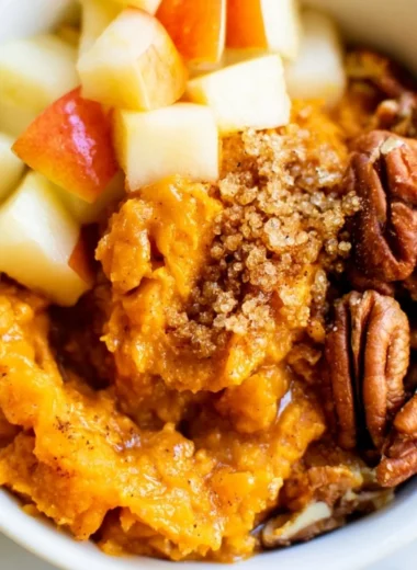 Sweet potato breakfast bowl with pecans and apples for a healthy meal.